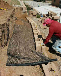 Retaining wall installation by Rising Sun Landscaping & Maintenance