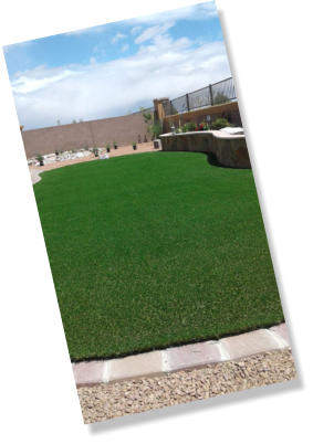 Synthetic lawn, artificial turf in back yard landscaping