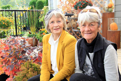 Enjoying back yard landscaping with friends by Rising Sun Landscape & Maintenance.